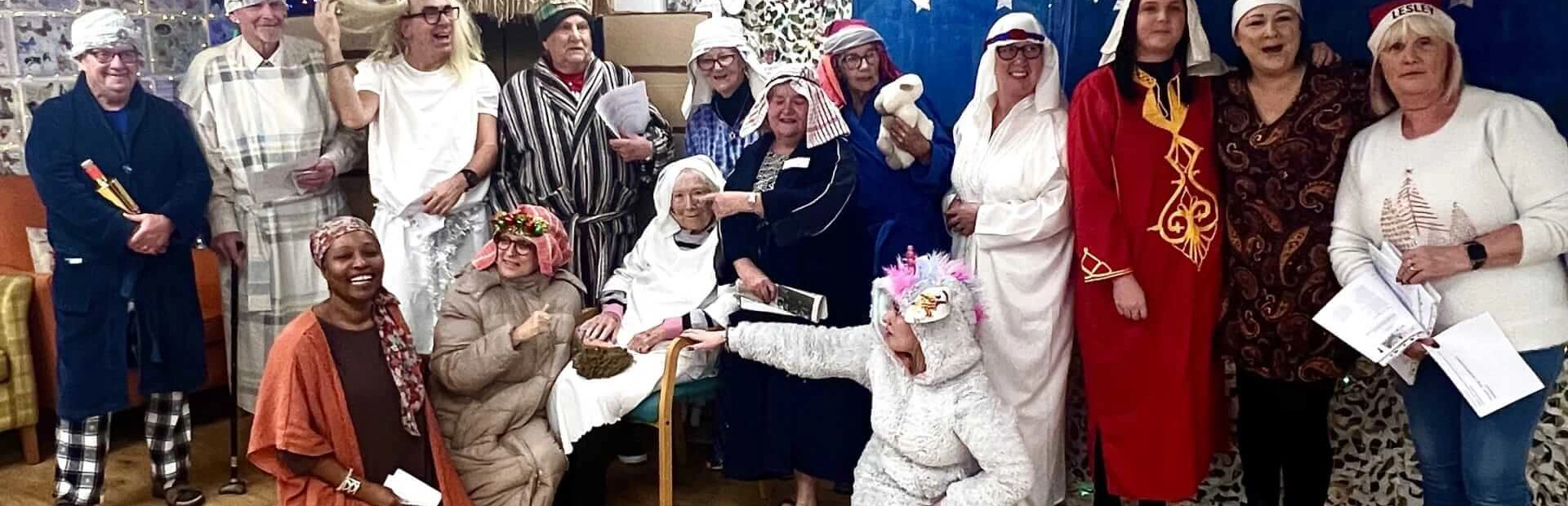 Old Silk Works Nativity scene, fifteen people standing together in a group, dressed in nativity costumes and with props all smiling. Old Silk Works Nativity scene, fifteen people standing together in a group, dressed in nativity costumes and with props all smiling.